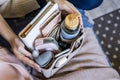 Closeup woman hands putting personal accessories into felt organizer. Concept storage organization Royalty Free Stock Photo