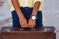 Closeup of woman hands holding vintage suitcase Royalty Free Stock Photo