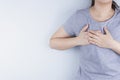 Closeup woman having heart attack or chest pain. Health care and medical concept Royalty Free Stock Photo