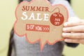 Closeup woman holding chat bubble with summer sale concept. Royalty Free Stock Photo