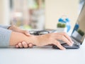 Closeup woman holding her wrist pain from using computer long ti