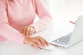 Closeup woman holding her wrist pain from using computer Royalty Free Stock Photo