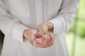 Closeup woman holding her wrist pain from using a computer. Office syndrome hand pain by occupational disease