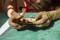 Closeup on woman holding purse at table Royalty Free Stock Photo