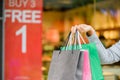 Closeup woman holding shopping bags in the shopping mall Royalty Free Stock Photo