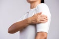 Closeup woman holds her arm injury, feeling pain. Health care and medical concept Royalty Free Stock Photo