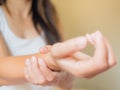 Closeup woman holds her wrist hand injury Royalty Free Stock Photo