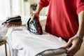 Closeup of woman ironing shirt Royalty Free Stock Photo