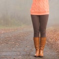 Closeup of woman legs in brown boots. Fall fashion Royalty Free Stock Photo