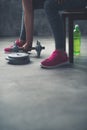 Closeup on woman lifting dumbbell from the floor Royalty Free Stock Photo