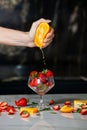 Closeup on woman making fruits salad. Preparing a healthy spring fruit salad.