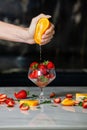 Closeup on woman making fruits salad. Preparing a healthy spring fruit salad.