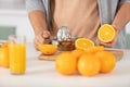 Closeup on woman making orange juice Royalty Free Stock Photo