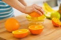 Closeup on woman making orange juice Royalty Free Stock Photo