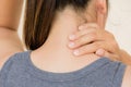 Closeup woman neck and shoulder pain and injury. Royalty Free Stock Photo