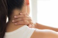 Closeup woman neck and shoulder pain and injury. Royalty Free Stock Photo