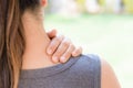 Closeup woman neck and shoulder pain and injury. Royalty Free Stock Photo