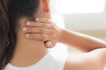 Closeup woman neck and shoulder pain and injury. Royalty Free Stock Photo