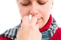 Closeup of woman nose using nasal spray Royalty Free Stock Photo