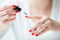 Closeup of a woman painting her nails Royalty Free Stock Photo