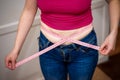 Closeup of woman pinching belly fat. Royalty Free Stock Photo