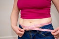 Closeup of woman pinching belly fat. Royalty Free Stock Photo