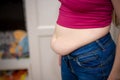 Closeup of woman pinching belly fat. Royalty Free Stock Photo