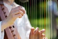 Closeup of a Woman playing a Harp