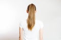 Closeup woman ponytail back view isolated on white background. Hair Natural blonde straight long Hairstyle. Easy quick simple Royalty Free Stock Photo