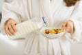 Closeup on woman pouring milk into plate Royalty Free Stock Photo