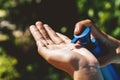 closeup woman putting sunscreen on hand Royalty Free Stock Photo
