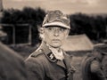 Closeup of a woman reenactor soldier in a military uniform during WW2. Historical reenactment Royalty Free Stock Photo