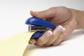Closeup Of Woman's Hand Stapling Document Royalty Free Stock Photo