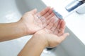 Closeup woman`s hand washing with soap in bathroom, selective focus Royalty Free Stock Photo