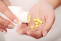 Closeup of woman`s hands holding medicine pills Royalty Free Stock Photo