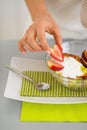 Closeup on woman serving fresh fruit salad Royalty Free Stock Photo