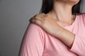 Closeup woman shoulder pain and injury. Health care and medical concept Royalty Free Stock Photo