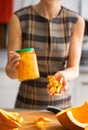 Closeup on woman showing jar of pickled pumpkin Royalty Free Stock Photo