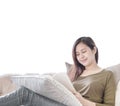 Closeup woman sitting on sofa for reading a book in free time in the afternoon isolated on white background , relax time of asian Royalty Free Stock Photo