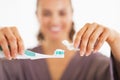 Closeup on woman squeezing toothpaste from tube Royalty Free Stock Photo