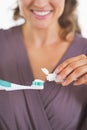 Closeup on woman squeezing toothpaste from tube Royalty Free Stock Photo