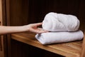 Closeup woman stack towel care hands female hygiene hotel health home white room clean