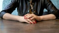 Closeup. the woman takes off her wedding ring sitting in a cafe Royalty Free Stock Photo