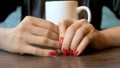 Closeup. the woman takes off her wedding ring sitting in a cafe Royalty Free Stock Photo