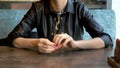 Closeup. the woman takes off her wedding ring sitting in a cafe Royalty Free Stock Photo