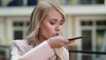 Closeup woman talking phone at street. Woman recording audio message outdoor Royalty Free Stock Photo