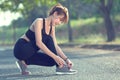 Closeup of woman tying shoe laces. Female sport fitness runner g Royalty Free Stock Photo