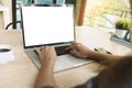 Closeup woman typing on laptop keyboard on desk