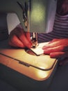 Closeup of a woman using a sewing machine Royalty Free Stock Photo