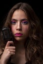 Closeup woman with vintage microphone. Girl singer. Concert, sing. Royalty Free Stock Photo